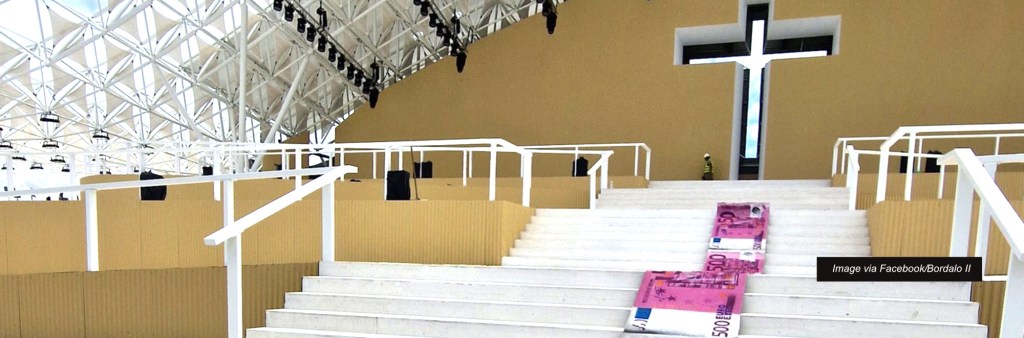 Street artist protests the €161-million cost of World Youth Day in Lisbon with an enormous banknote&nbsp;carpet