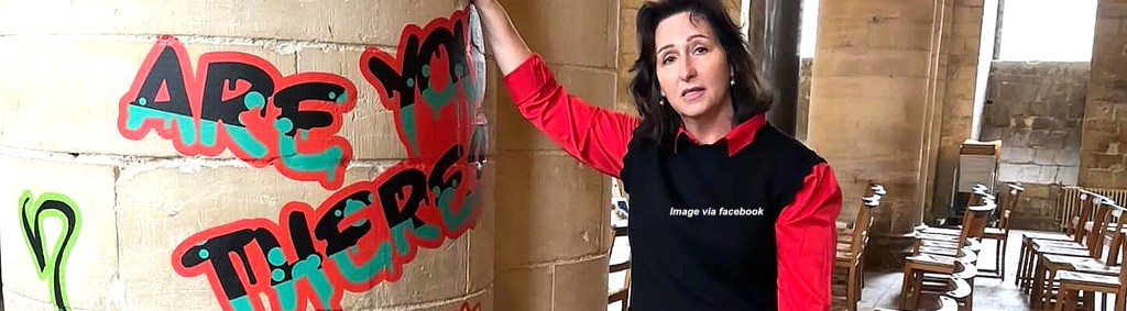 Organisers of a graffiti exhibition at Canterbury Cathedral that poses questions to God receive abuse from&nbsp;Christians